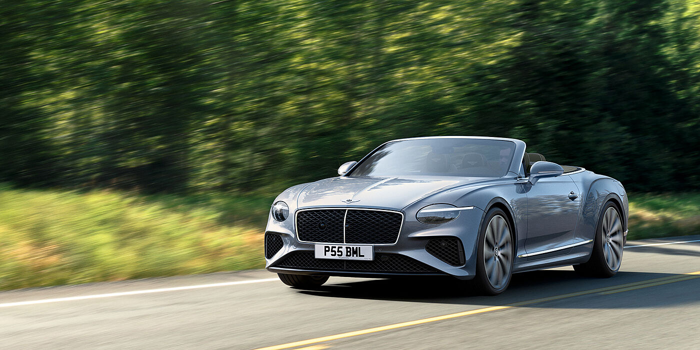 Jack Barclay New Bentley Continental GTC convertible front view in Silverlake paint with 22 inch ten spoke wheels, driving dynamically on a country road