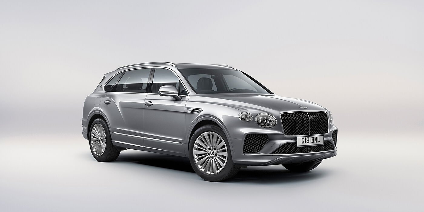 Jack Barclay Bentley Bentayga Extended Wheelbase luxury SUV front three quarter view in Moonbeam paint with 21 inch five spoke painted wheels