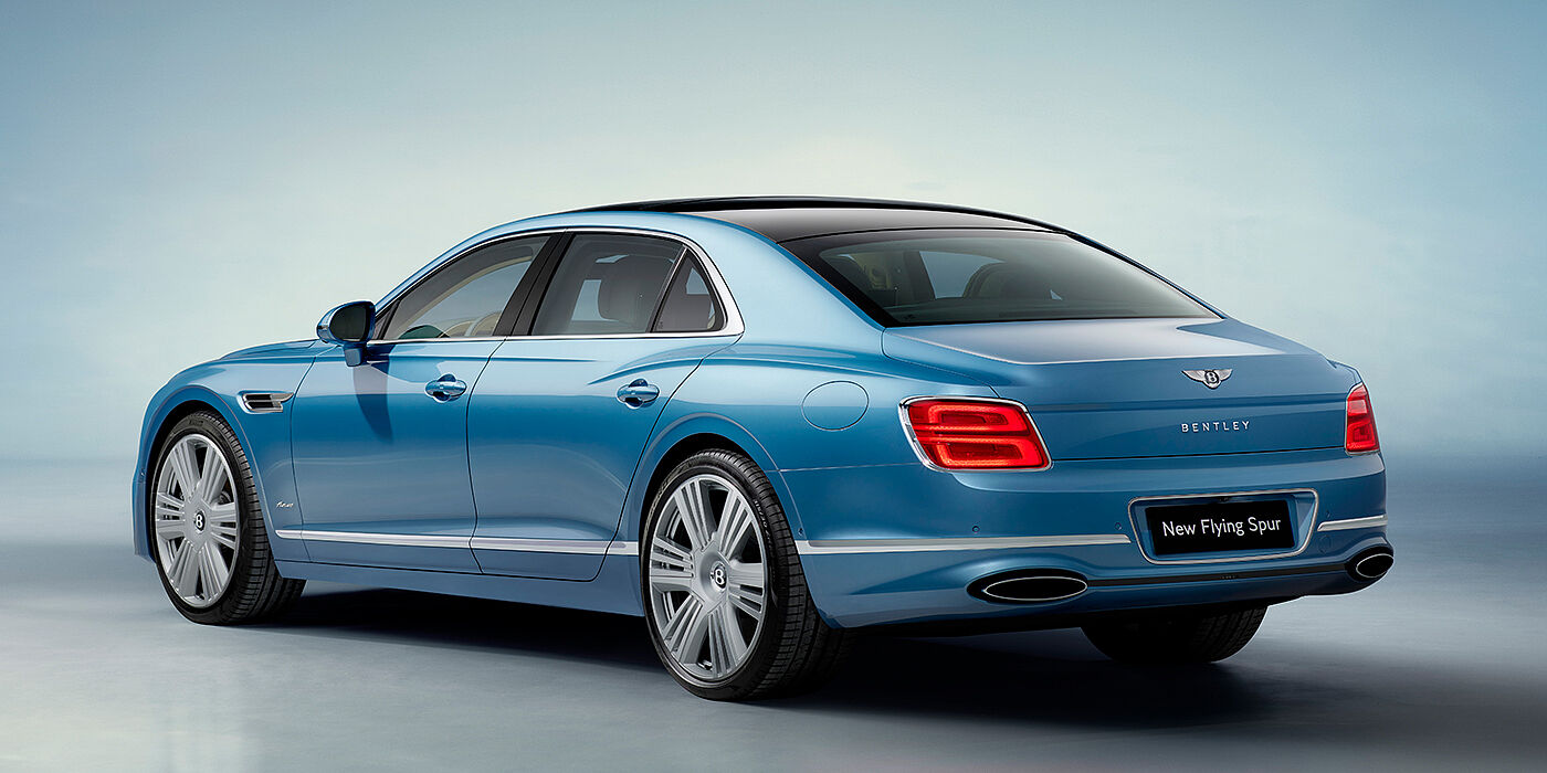 Jack Barclay New Bentley Flying Spur Azure sedan rear view in Light windsor blue by Mulliner paint with 22 inch Azure wheels and chrome exterior details