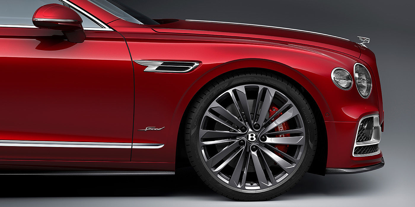Jack Barclay Bentley Flying Spur Speed sedan front wheel in close up with Dragon Red II paint