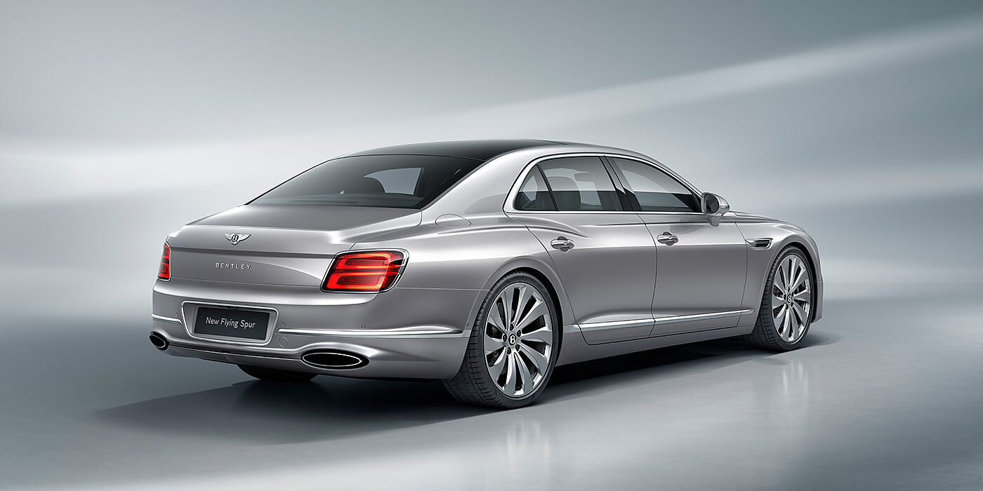 Jack Barclay New Bentley Flying Spur sedan rear view in Silverlake paint with ten spoke wheels and chrome matrix grille