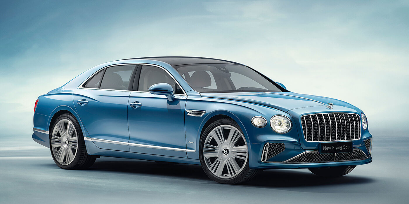 Jack Barclay New Bentley Flying Spur Azure sedan front view in Light windsor blue by Mulliner paint with 22 inch Azure wheels and chrome exterior details