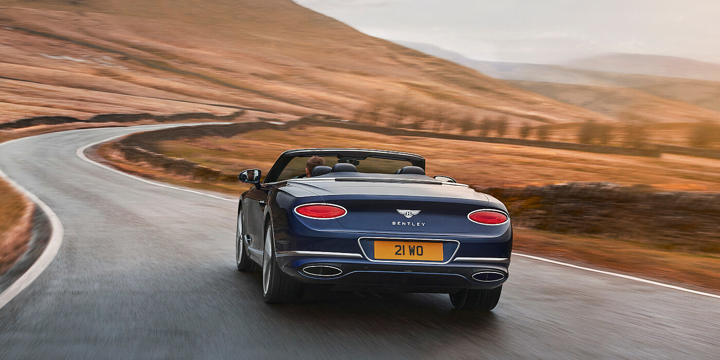 new-bentley-continental-gt-speed-convertible-in-peacock- blue-rear-three-quarter-in-peak-district