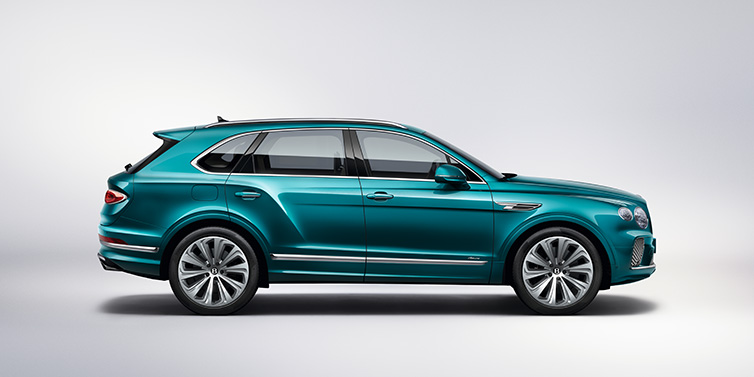 Jack Barclay Bentley Bentayga Azure SUV in profile in Topaz blue paint featuring 22 inch 10 spoke directional wheels against a white background