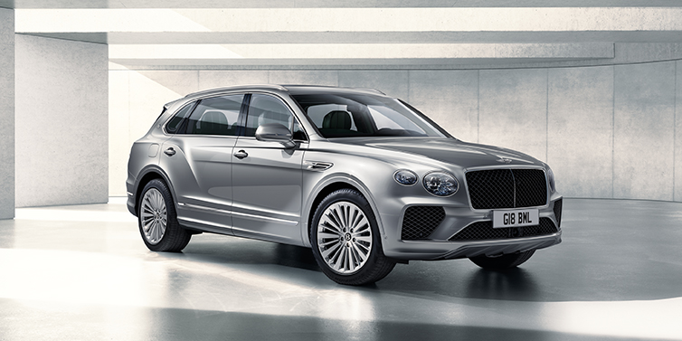 Jack Barclay Bentley Bentayga Extended Wheelbase SUV front three quarter in Moonbeam paint with a grey background