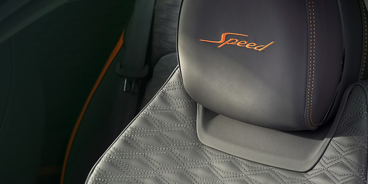 Jack Barclay Bentley Continental GT Speed coupe seat detail in Gravity Grey hide and Speed emblem in Mandarin by Mulliner coloured embroidery