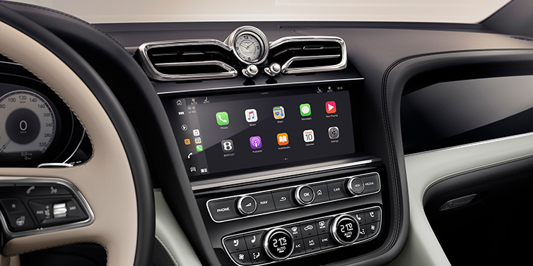 Jack Barclay Bentley Bentayga Extended Wheelbase Mulliner SUV front interior centre console with MMI screen showing Apps surrounded by Linen and Beluga black hide