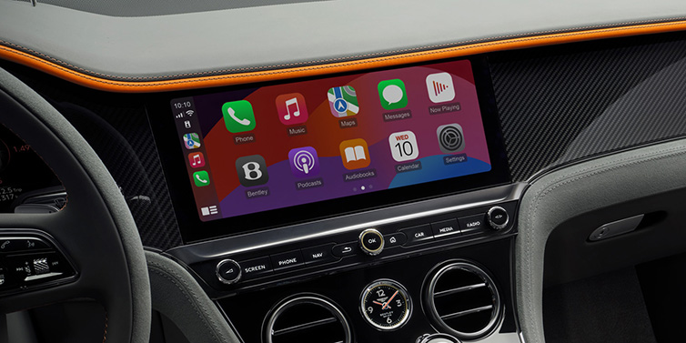 Jack Barclay Bentley Continental GT Speed coupe front interior centre console with MMI screen featuring Apps surrounded by Mandarin by Mulliner and Gravity Grey hides