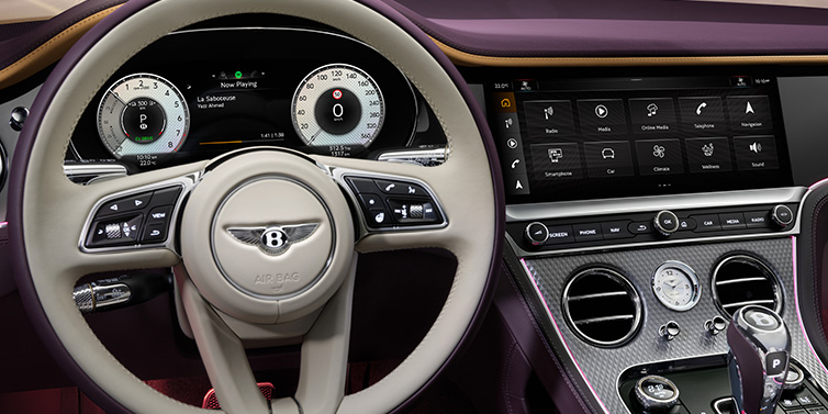 Jack Barclay Bentley Continental GTC Mulliner convertible steering wheel and drivers screens surrounded by Damson purple and Linen hides